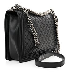 This is an authentic CHANEL Calfskin Quilted Large Boy Flap in Black. This chic shoulder bag is crafted of diamond quilted luxurious calfskin leather with a linear quilted border in black. The bag features a ruthenium chain-link shoulder strap with a leather shoulder pad and a ruthenium Chanel boy CC push lock. The flap opens to a gray fabric interior with a flat pocket. Gray Fabric, Chanel Boy, Diamond Quilt, Grey Fabric, Shoulder Pads, Chain Link, Calf Skin, Shoulder Strap, Chanel