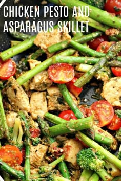 chicken, pesto and asparagus skillet in a pan with tomatoes on the side