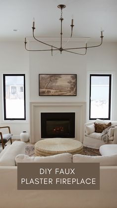 a living room filled with furniture and a fire place under a chandelier over a fireplace