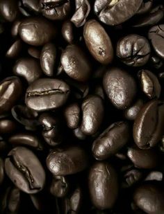 a pile of coffee beans sitting on top of each other