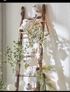 an old ladder is decorated with christmas decorations