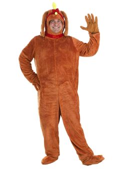 a man in a turkey costume is waving at the camera with his hands up and smiling