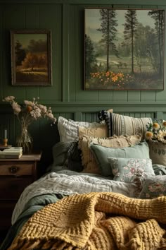 Cozy sage green bedroom featuring paneled walls, vintage landscape paintings, and a mix of textured blankets and pillows for a warm ambiance. Bedroom Magic, Green Bedroom Furniture, Vintage Decorating, House Details, Bedroom Style, Green Walls, Cottage Bedroom