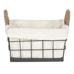 a black wire basket with white linen linings and brown handles on an isolated white background