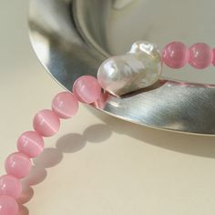 This stunning choker necklace comes in two colors, pink and blue, with pink and blue opal combined with baroque pearls. The unique blend of colors and textures creates a striking contrast, while the irregular shape of the Baroque pearls adds a touch of organic beauty. It's perfect for adding a pop of color and glamor to any look. Metal: 18K Recycled Gold Plated On Brass Gemstone: Baroque Pearls,Cat's Eye Stone Necklace Length: 360-410mm Weight: 47.5g Elegant Pink Opal Necklace, Pink Pearl Necklace With Round Beads And Pendant, Pink Single Strand Baroque Pearl Jewelry, Pink Baroque Pearl Necklaces For Jewelry Making, Pink Single Strand Baroque Pearl Necklace, Pink Baroque Pearl Single Strand Necklace, Pink Pearl Jewelry With Gemstone Beads, Pink Pearl Necklace With Round Beads, Pink Pearl Necklace With Natural Round Beads