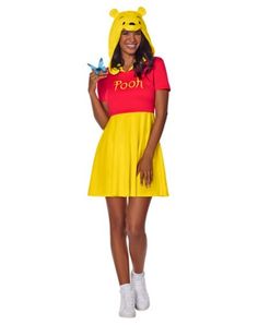 a woman dressed in winnie the pooh costume