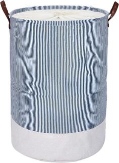 a blue and white striped laundry hamper with leather handles on the handle, sitting in front of a white background