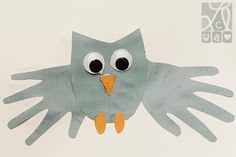 an owl made out of paper with large eyes