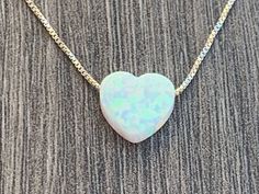 "Opal Heart Charm Necklace ** Please measure your neck before ordering (standard size is 16-18) ** 13\" & 14\" chains can not be returned Necklace Details: Sterling Silver 0.7mm Box Chain 14kt Gold Filled 0.7mm Box Chain Charm Details - Lab Created OPAL Opal Heart Charm - 10mm (Light Blue, Blue or White ) 100% satisfaction guaranteed . If for any reason you are not happy with this product you may ship it back. See other ideas: https://www.etsy.com/listing/652743766/opal-heartbeat-sterling-si White Heart Pendant Jewelry For Birthday Gift, White Heart Cut Jewelry As Gift, White Heart Cut Jewelry For Gift, White Heart Cut Jewelry Gift, White Heart Cut Jewelry For Anniversary Gift, White Heart Cut Jewelry For Anniversary, Great Graduation Gifts, Heart Charm Necklace, Gift Teacher