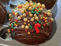 a cake with chocolate frosting and sprinkles on it