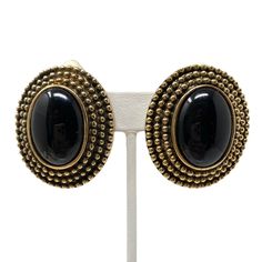 "Gorgeous vintage statement earrings! Bronze colored metal with black glass cabochons Clip ons Circa 1980s New old stock Never worn Measure 1 5/8\" long & 1 3/8\" wide Great vintage condition. Please enjoy! Thanks for visiting ♥" Black Retro Clip-on Jewelry, Vintage Black Metal Earrings, Vintage Black Enamel Clip-on Earrings, Black Vintage Metal Earrings, Vintage Black Metal Clip-on Earrings, Vintage Black Clip-on Earrings, Vintage Metal Cabochon Earrings, Vintage Cabochon Metal Earrings, Black Vintage Clip-on Earrings