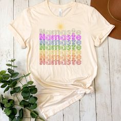 a t - shirt with the words sunrise and rainbow written in different colors on it