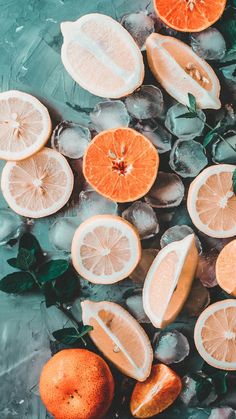 oranges and mint leaves on ice with water in the backgroung, top view