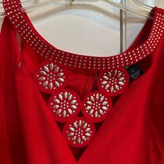 Nwt: Red Off The Shoulder Blouse It Has Rhinestones Around A Color Neck It Also Has 5 Circles In Front With Beautiful Detail Rhinestones The Fabric On The Circles Fells Like Felt Size L Material Is 95% Polyester & 5 % Spandex Great For The Up Coming Holidays Red Embellished Sleeveless Top, Glamorous Red Blouse, Red Embellished Evening Blouse, Red Embellished Blouse For Evening, Off The Shoulder Blouse, A Color, Circles, Off The Shoulder, Tops Designs