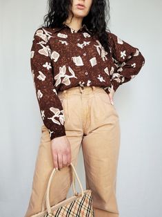 Vintage 80s brown floral long sleeve minimalist shirt blouse Shirt is in great vintage condition. Model usually wears UK 10-12 / S-M / US 6-8. Item could fit UK 12-14 / M-L / US 8-10. Check the measurements before buying. MEASUREMENTS: bust - 112 cm, length - 66 cm. Item made from mixed material. Care delicate. Color may differ slightly depending on the color calibration of the device you're viewing on. If You have more questions about products or shipping, please drop me a message. Wish You great shopping, Mellina Brown Vintage Print Top For Spring, Brown Floral Print Long Sleeve Tops, Brown Long Sleeve Floral Print Tops, Vintage Brown Floral Print Tops, Vintage Brown Floral Print Blouse, Vintage Brown Blouse With Floral Print, Brown Vintage Blouse For Spring, Retro Long Sleeve Brown Blouse, Brown Floral Print Long Sleeve Blouse