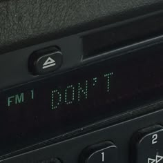 an old radio with the time displayed on it's display and two buttons that read 1 00 pm