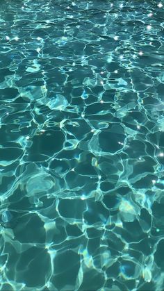 the water is very clear and blue with little ripples on it's surface