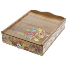 a wooden box with flowers painted on it