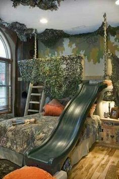 a bedroom with a slide in the middle of it