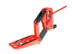 a red jacking machine with two tools attached to it