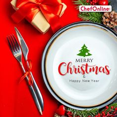 a merry christmas and happy new year dinner plate with fork and knife on red background