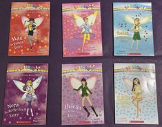 four children's books with fairy characters on them, all in different colors and sizes