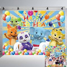 a birthday backdrop with balloons and animals