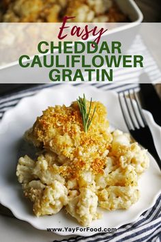 a white plate topped with cauliflower covered in gravy next to a casserole dish