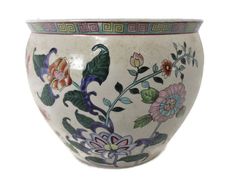 a white vase with flowers painted on it