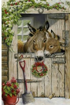 two donkeys are looking out the window with christmas wreaths on their windowsill