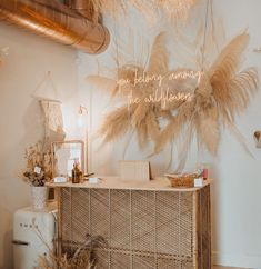 a display with feathers hanging from the ceiling