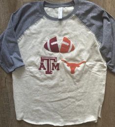 Check out our awesome collection of custom handmade House Divided sports team tees!  Support your favorite sports teams in style in one of our unique shirt designs. These shirts are perfect for the whole family, from infants to adults, and they're all about showing off your "House Divided" team spirit. Whether it's college teams or professional baseball, football, or soccer, we've got you covered! Each shirt is carefully made with fabric appliques sewn on, creating a one-of-a-kind design that st Collegiate T-shirt With Custom Print For Game Day, Varsity T-shirt With Custom Print For Game Day, Collegiate T-shirt With Custom Print For Fans, Collegiate T-shirt With Custom Print, Collegiate Short Sleeve T-shirt With Custom Print, Collegiate Style Custom Print T-shirt, Collegiate White T-shirt With Heat Transfer Vinyl, Varsity Cotton T-shirt With Custom Print, White Collegiate T-shirt With Heat Transfer Vinyl