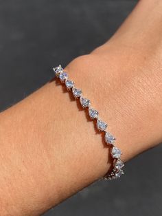 MaterialGold, Diamond DescriptionUp for sale is a beautiful 14K Gold Sideways Pear Diamond Tennis Bracelet. Specifications:-Model #: DP3216-Metal Type: Yellow, White, or Rose Gold-Metal Purity: 14K-Chain Length: 7"-Bracelet Width: 4MM-Gold Weight: 8.28 grams approx.-Total Diamond Weight: 7.85 carats approx.-Color: F-G-Clarity: SI Brief Overview:-Free Sizing W/ Purchase-14 Day Return Policy-Conflict Free Diamonds-Satisfaction Guarantee-Appraisal Included W/ Purchase.-Black Velvet Box Included W/ Online Buying, Arranged Marriage, Diamond Tennis Bracelet, Rose Gold Metal, Tennis Bracelet Diamond, Pear Diamond, Pear Shaped Diamond, Tennis Bracelet, Conflict Free Diamonds