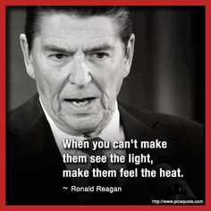 ronald reagan quote about light and heat on black and white photo with red border frame