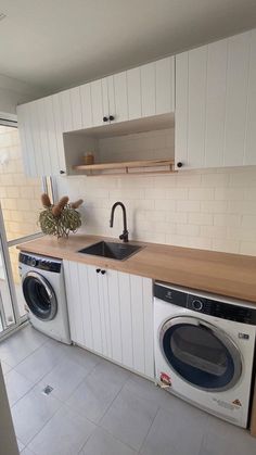 a washer and dryer in a small kitchen