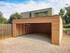 a large wooden garage sitting in the middle of a yard