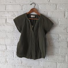 Gauzy Cotton Top In The Perfect Shade Of Green. Casual Olive V-neck Top, Olive V-neck Tops For Spring, Olive Tops For Summer Workwear, Casual Green Split Neck Top, Casual V-neck Top For Spring Layering, Casual Daywear Tops With Split Neck, Casual Split Neck Top For Daywear, Short Sleeve V-neck Top For Spring Layering, Casual Cotton V-neck Top For Work