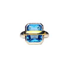 Classic color collocation of golden and blue, under an exquisite octagon square-cut Zircon gem, give a feeling of sunset shining on the ocean waves, like a golden belt quilting the water, gently. Classic and elegant Material: Silver and Blue Zircon Blue Square Cut Topaz Ring, Blue Topaz Ring With Square Cut Gemstone, Blue Square Cut Topaz Ring Gift, Gift Blue Square Cut Topaz Ring, Blue Rectangular Topaz Jewelry, Blue Rectangular Faceted Jewelry, Rectangular Gold Jewelry With Accent Stones, Luxury Blue Rectangular Rings, Gold Rectangular Blue Topaz Rings