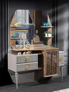 a dressing table with a mirror on top of it and some drawers in front of it