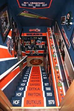 an orange and blue staircase with pictures on it