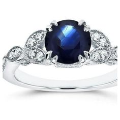 an oval blue sapphire and diamond ring