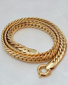 --- Created in GURANTEED HIGH QUALITY 18-Karat SOLID/REAL GOLD --- Not Gold Filled or Plated! ** Chain options base on their lengths, thickness and weights: 16 inches - 7 millimeter : 18.61 gr (grams weight) 18 inches - 7 millimeter : 20.94 gr (grams weight) 18.5 inches (added jump rings) - 7 millimeter : 21.52 gr (grams weight)   Closer: large clasp spiring ring Style: Curb * A gold Curb chain necklace is an accessory that instantly takes your style to the next level; just slip it on your neck for an effortlessly elegant and sophisticated look. Wear it all day, Everyday. it's also very study to hold your favorite pendant or ring. A perfect gift for everyone every occasion! * About 18K Solid Gold 18k solid gold pieces are made to last forever. Solid 18K gold jewelry is the most expensive a Gold Curb Chain, 18k Gold Chain, Real Gold Jewelry, Chain For Men, Curb Chain Necklace, Precious Jewels, 18k Gold Jewelry, Jewelry Stand, Ring Style