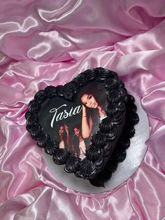 a heart shaped cake with a picture of a woman on it