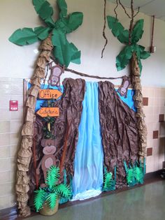 this is an image of a jungle themed classroom decoration with trees and animals on it