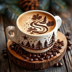 a cappuccino on a wooden coaster with coffee beans and pine cones around it