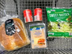 a grocery cart filled with bread, salad and other items to make it easier for people to eat