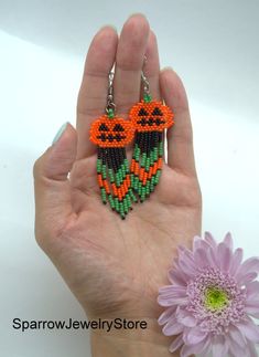 "Stylish earrings for Halloween, Seed bead pumpkin earrings These pumpkin earrings for Halloween are specially made for you to emphasize your style for the holiday. They emphasize your style and help you stand out from everyone else. This earrings is made from the high-quality Czech bead, with the use of sterling silver furnice, with a bright pumkin pattern. This pumpkin earrings can carry every girls and woman of any age, harmonizes with any clothes. Earrings details: Length: Dangle earrings me Halloween Beaded Dangle Earrings Gift, Halloween Gift Beaded Dangle Earrings, Beaded Dangle Earrings For Halloween, Dangle Beaded Earrings For Halloween, Handmade Dangle Earrings For Halloween, Adjustable Beaded Earrings For Halloween, Beaded Pumpkin Earrings, Halloween Seed Bead, Bead Pumpkin