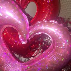 two heart shaped balloons in the shape of hearts