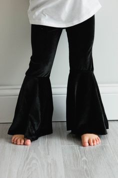 Super soft black velvet pants. Ready to ship! Size Chart - Crotch to hem 12 month - 10 inches 18 month - 10 1/2 inches 2T - 11 1/2 inches 3T - 12 1/2 inches 4T - 13 1/2 inches 5T - 14 1/2 inches 6 - 16 1/2 inches 7 - 17 1/2 inches 8 - 18 1/2 inches 10 - 21 1/2 inches 12 - 22 1/2 inches Fitted Black Velvet Pants, Black Fitted Velvet Pants, Black Stretch Velvet Pants, Black Velvet Pants For Party, Pumpkin Dress, Black Velvet Pants, Flutter Dress, Ruffle Pants, Velvet Pants