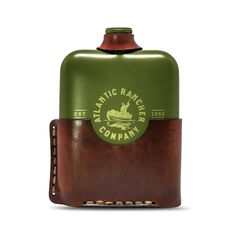 a green and brown flask with the words atlantic rancher company on it's side